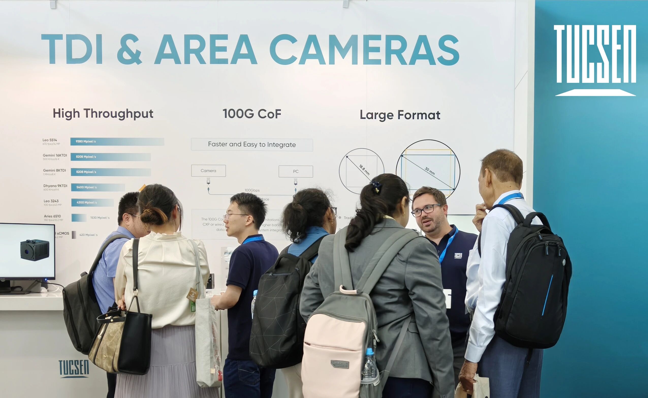 Visitors discuss Tucsen’s TDI and area cameras booth